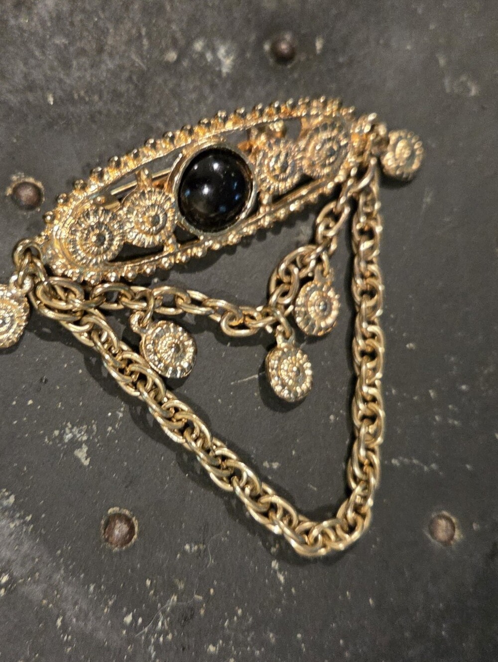 Gold-Tone Filigree Drop Brooch with Black Stone